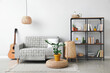 © Pixel-Shot - Interior of modern living room with shelf unit and sofa