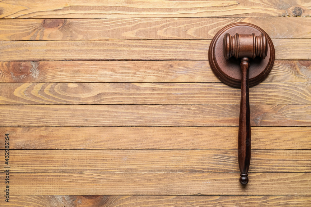 Judge's gavel on wooden background