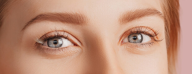 Wall Mural - beautiful sensual young girl with clean skin. female eyes close-up shot. woman looking at the camera