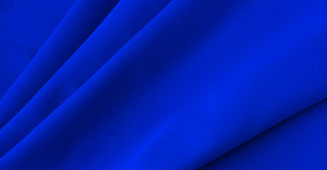smooth elegant blue silk or satin luxury cloth texture can be used as abstract background. crumpled 