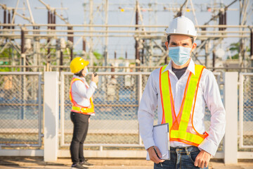 Wall Mural - Asian man wear mask protect coronavirus and work in power plant