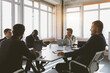 © xartproduction - Group of young business people working and communicating while sitting at the office desk together with colleagues sitting. business meeting