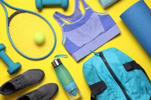 Flat Lay Composition With Sports Equipment On Yellow Background