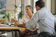 © Jacob Lund - Business colleagues working on new project