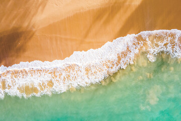 Summer seascape from drone. Tropical beach and waves, Turquoise water abstract background from top view. Vacation Travel and idea concept.