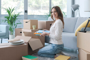 Woman unpacking in her new house