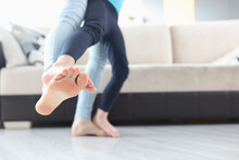 Mother And Daughter Dancing Barefoot On Floor Together Closeup