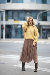 Poster - Vertical shot of a Caucasian female posing outdoors