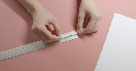 girl doing measurement for ring size