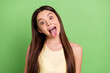 © deagreez - Portrait of young satisfied person open mouth tongue out look camera isolated on green color background