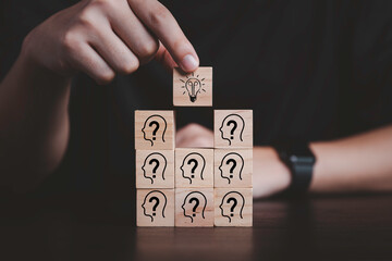 Poster - hand putting wooden cube block stacking which print screen light bulb and question mark with human ,