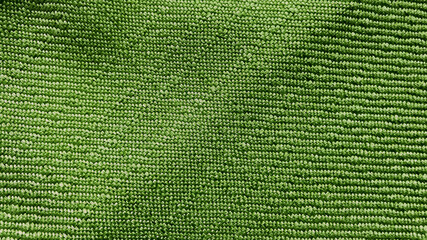 Wall Mural - bright olive green textile fabric texture use for background. close-up or macro view of textile vivid green fabric showing detailed of fibers.