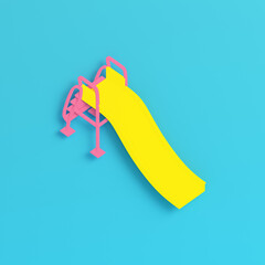 Yellow children slide on bright blue background in pastel colors