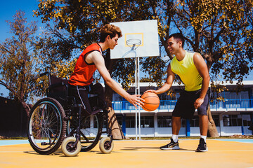 latin young man using wheelchair and playing basketball with a friend in Latin America disabled person