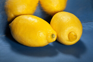 mirrored lemon on blue background