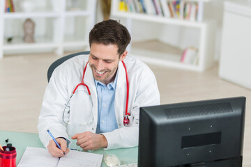 funny doctor smiling in his office