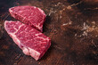 © Vladimir - Raw Denver steak Marble beef meat. Dark background. Top view. Copy space