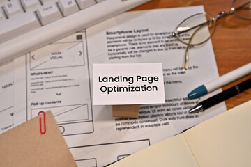 Leinwandbilder - On a desk with a keyboard and a piece of paper with a dummy web design on it, there is a card with the word Landing Page Optimization written on it.