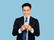 © Tom Wang - Young business man reading good news on internet with mobile phone