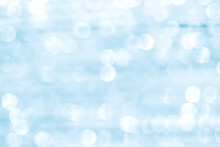 Blurred White Light Blue Glitter Abstract Bokeh Background