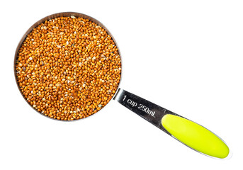 Wall Mural - proso millet grains in measuring cup cutout
