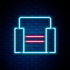 Poster - Glowing neon line Cinema chair icon isolated on brick wall background. Colorful outline concept. Vector