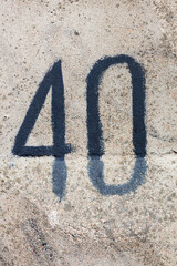 Poster - figure forty on a concrete wall. number on stone texture