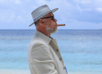 Sticker - man with a cigar on a tropical island