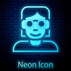 Glowing neon Hacker or coder icon isolated on brick wall background. Programmer developer working on code, coding, testing, debugging, analysing. Vector