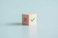 True And False Symbols Accept Rejected For Evaluation, Yes Or No On Wood Blogs On Blue Background.