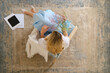 © boomeart - View from above at a woman sitting in armchair with flowers in hand
