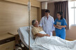 © Thirawatana - Doctors and physical therapists are caring for elderly sick people. Doctor and nurse taking care of elderly patient on the bed at hospital room.