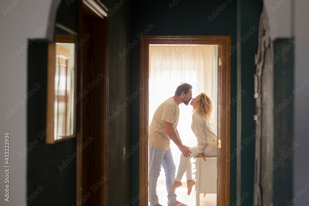 Romantic couple kissing at home - happy relationship man and woman ...
