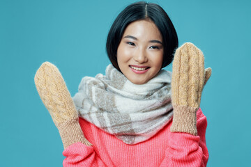 Wall Mural - cheerful woman asian appearance winter gloves clothing fashion