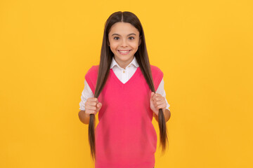 Poster - happy teen girl on yellow background. childhood happiness. back to school.