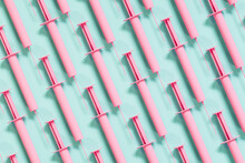 Pink Syringes On Green Background