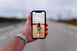 © CSSHOT/Westend61 - Man photographing woman with skateboard standing on road