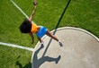 © Trevor Adeline/Caia Image - Female track and field athlete throwing discus