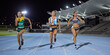 © Trevor Adeline/Caia Image - Female track and field athletes running in competition on night track