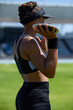 © Trevor Adeline/Caia Image - Female track and field athlete preparing to throw discus