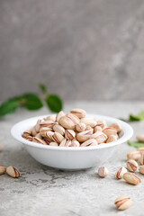 Poster - Pistachious in a bowl, front view