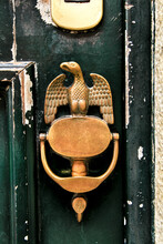 Vintage Door Knocker Eagle Shaped On Wooden Door