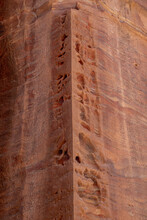 Signs Of Weathering And Erosion On A Wall Carved In Red-rose Sandstone Rock Formation In Petra, Jordan 
