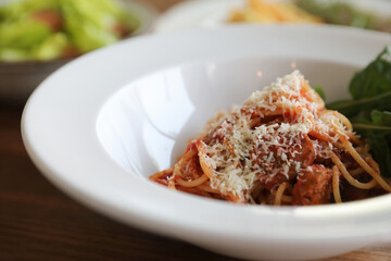 Wall Mural - spaghetti Bolognese with italian sausage and tomato sauce with parmesan cheese and basil