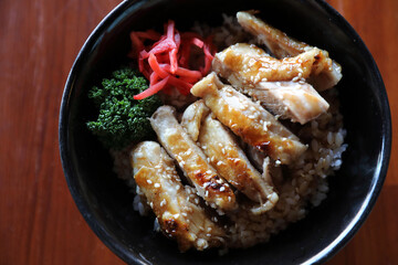 Wall Mural - japanese food Chicken teriyaki with rice on wood background