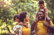 © liderina - African American family having fun outdoors.