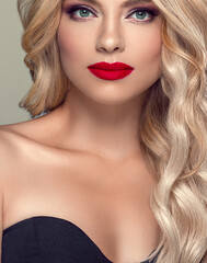 Wall Mural - Red lips woman Blonde Hair Woman Beautiful Curly Hairstyle Wavy Long hair Red Lips. Grey Background. Studio shot.