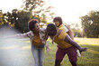 © liderina - Family playing in the park.  African American family having fun outdoors.