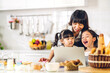 © Art_Photo - Portrait of enjoy happy love asian family mother and little toddler asian girl daughter child having fun cooking together with dough for homemade bake cookie and cake ingredient on table in kitchen