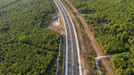 Wall Mural - aerial view on road. highway through mountain valley. view from a drone. natural landscape in summer